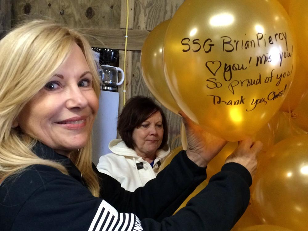 Carol getting ready to release her balloon in honor of her son, Brian